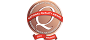 Logo for the National Quality Award – Bronze Commitment to Quality. Timberhill Place received the award in 2012.